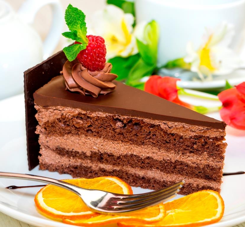 Picture of a slice of decadent chocolate cake.